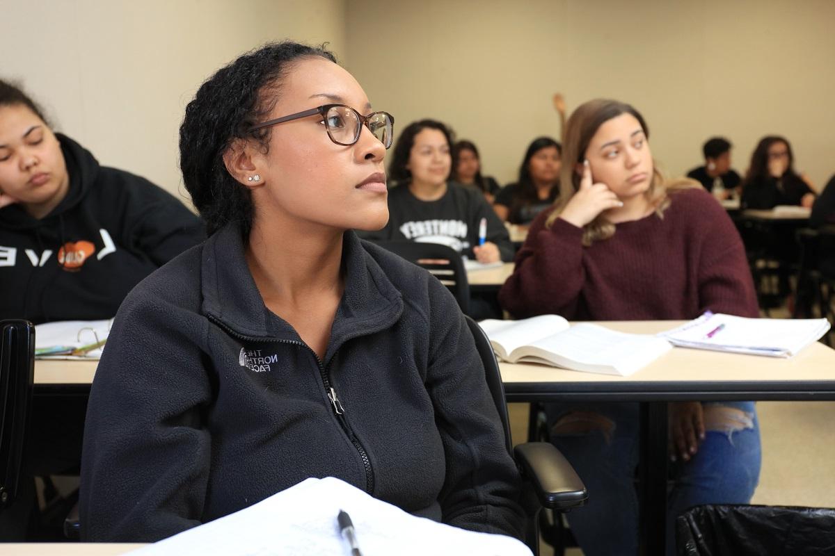 Female student listens in class